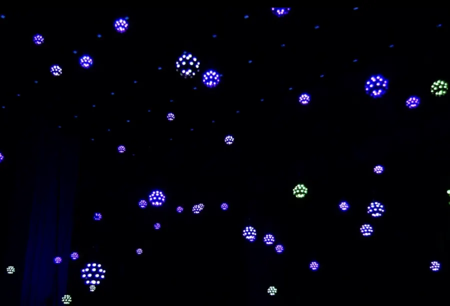Mini orbs hanging in a dark room