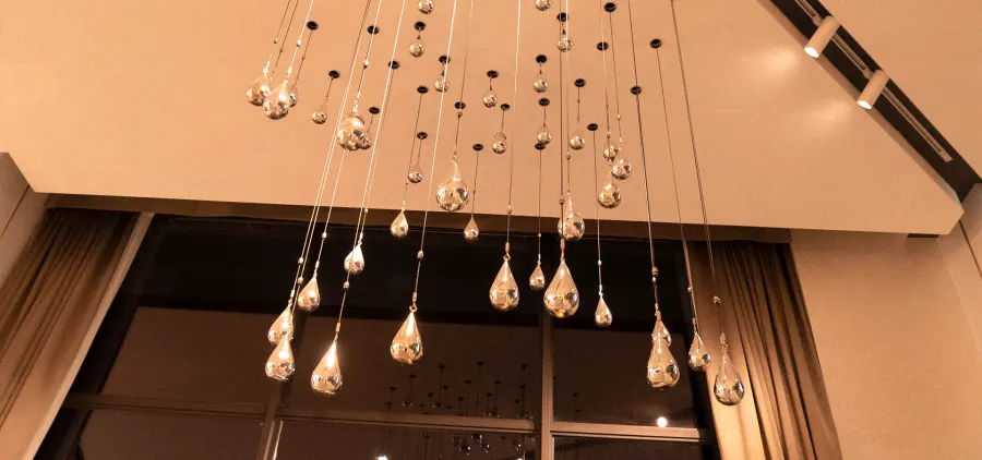 Polished metal rain drops over a bar